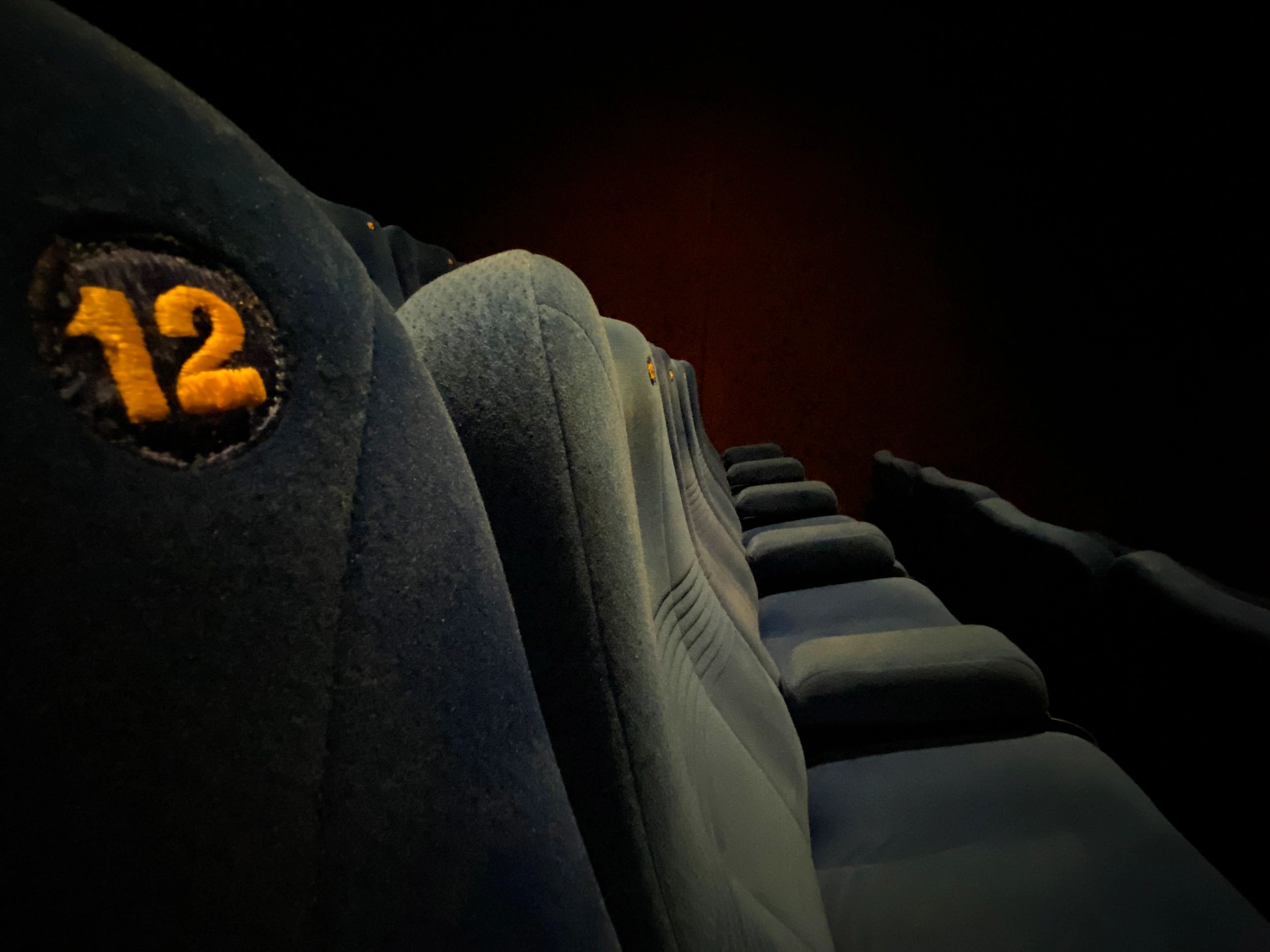Rows of empty seats inside a movie theater