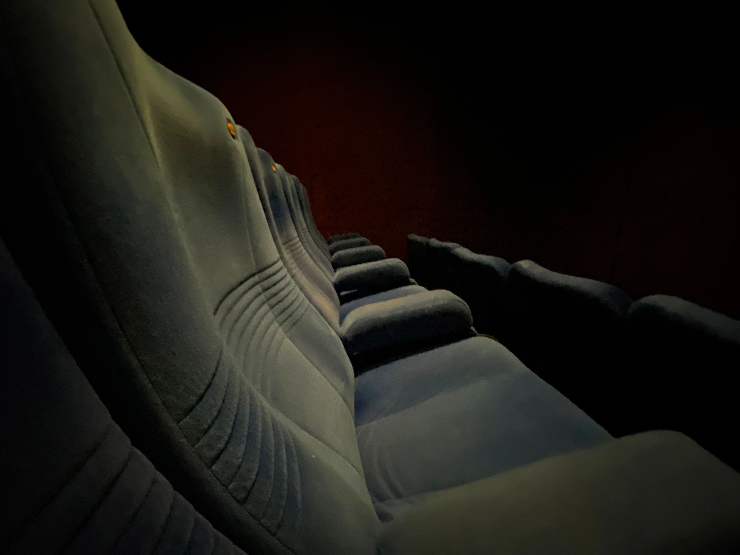 Empty theater seats in a modern cinema