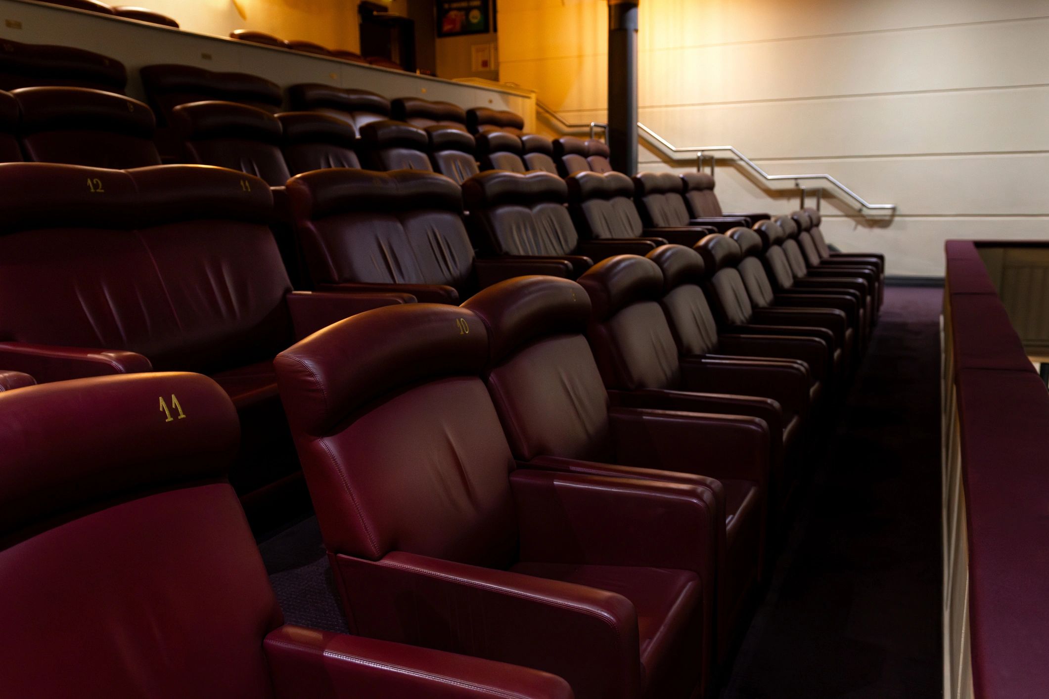 Modern cinema seating in a dark theater
